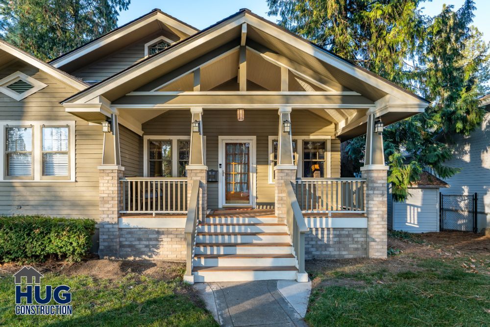 Suburban single-story house with a covered front porch and steps, featuring remodels and additions, highlighted by the 