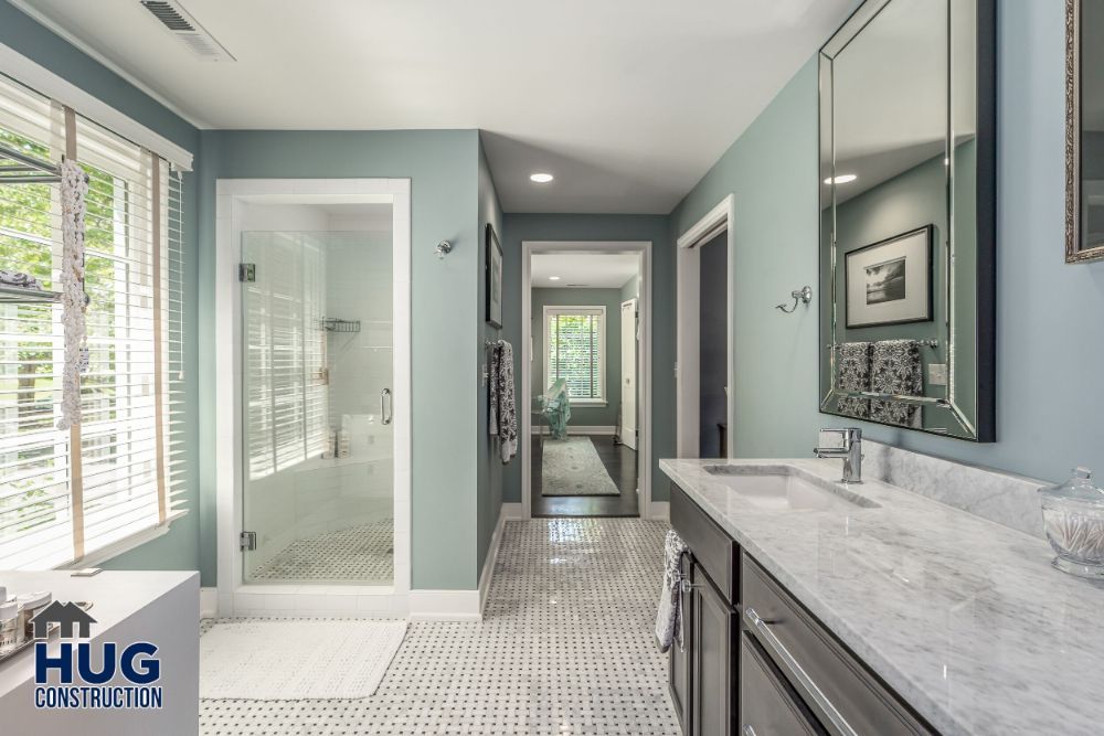 Modern bathroom remodel with a walk-in shower and double vanity.