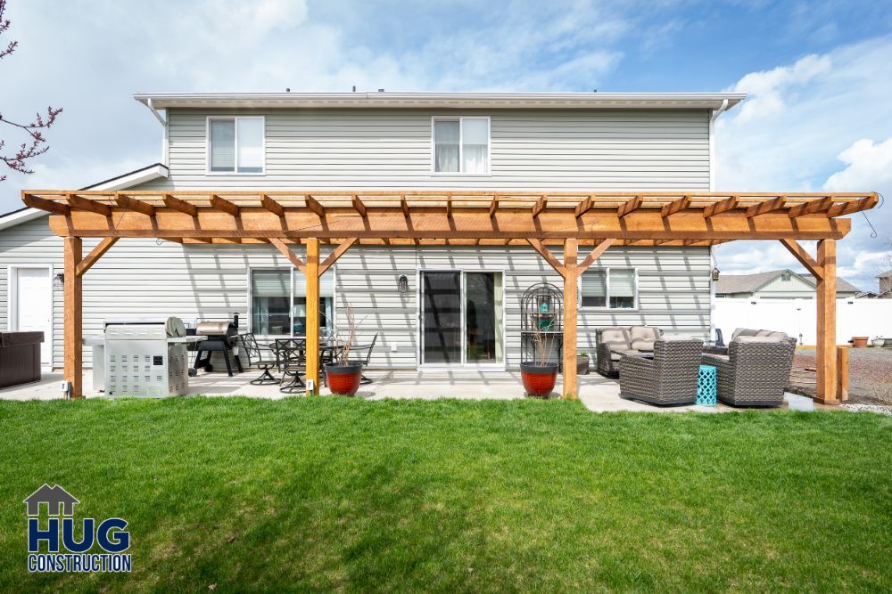 A two-story house with new remodels and additions including a wooden pergola in the backyard.